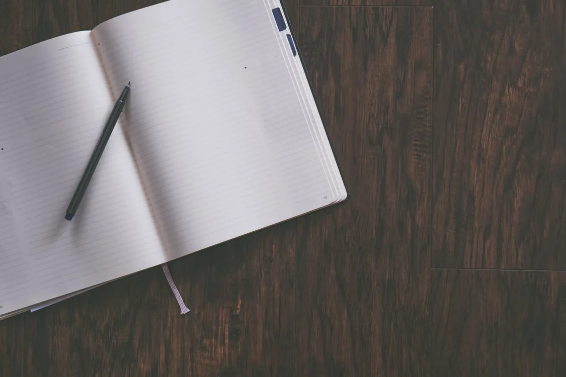 Notebook and pen for planning written content